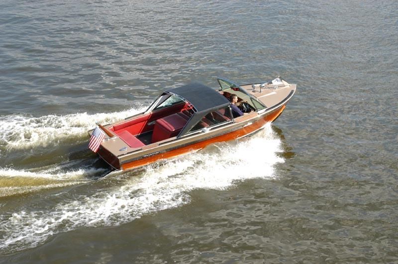 a boat is floating on top of a body of water .