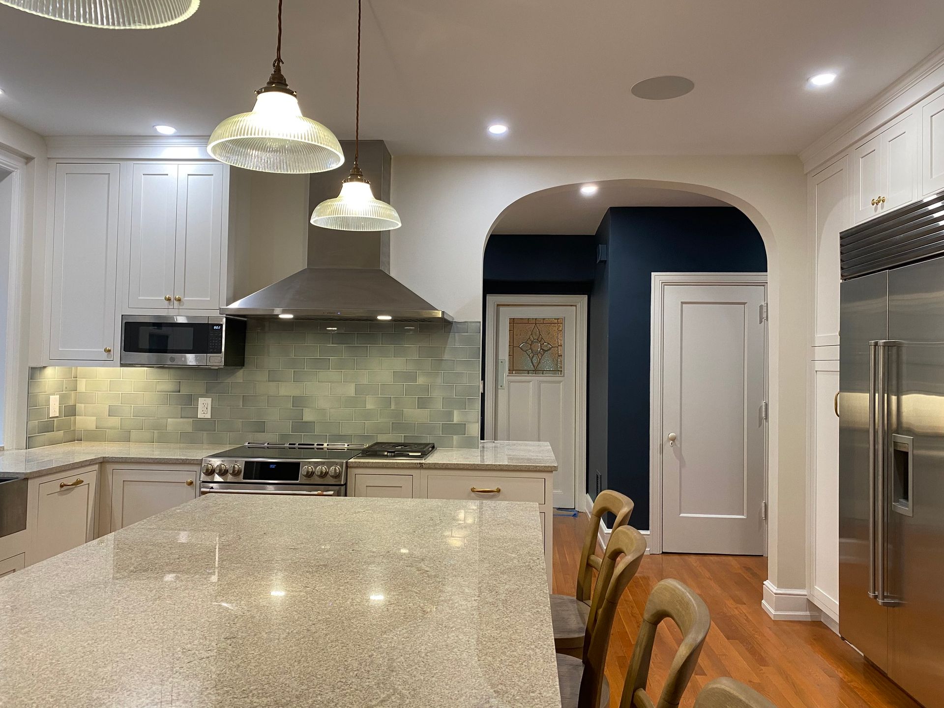 A kitchen with a large island and stainless steel appliances. James McCoy Remodeling Services Serving 19072,19003,19118,19444,19095 and surrounding areas