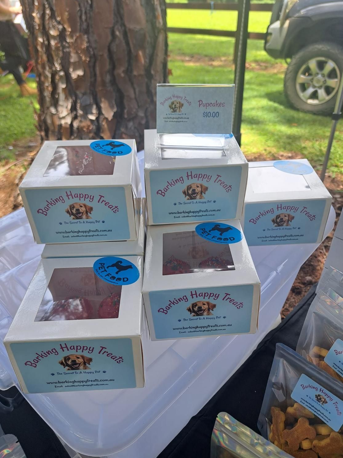 Several Boxes Of Dog Treats Are Stacked On Top Of Each Other On A Table — Barking Happy Treats In Collombatti, NSW