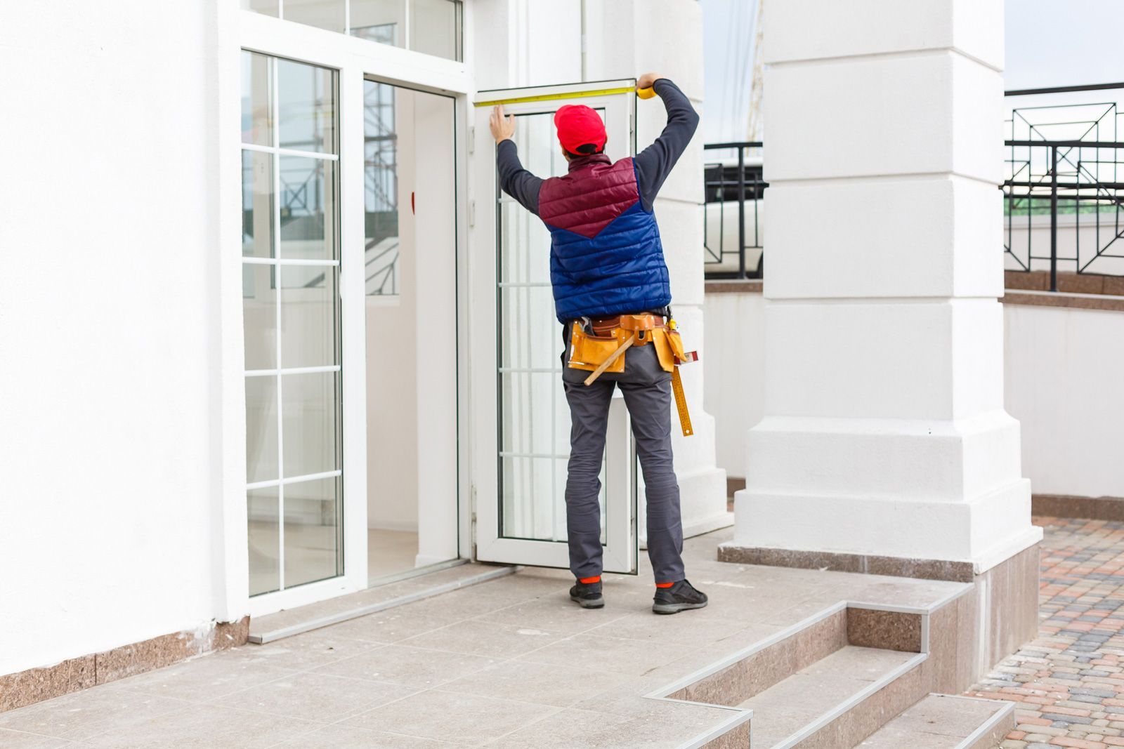 Measuring The Door — Madison, WI — TOTL Construction, LLC Measuring The Door — Madison, WI — TOTL Construction, LLC