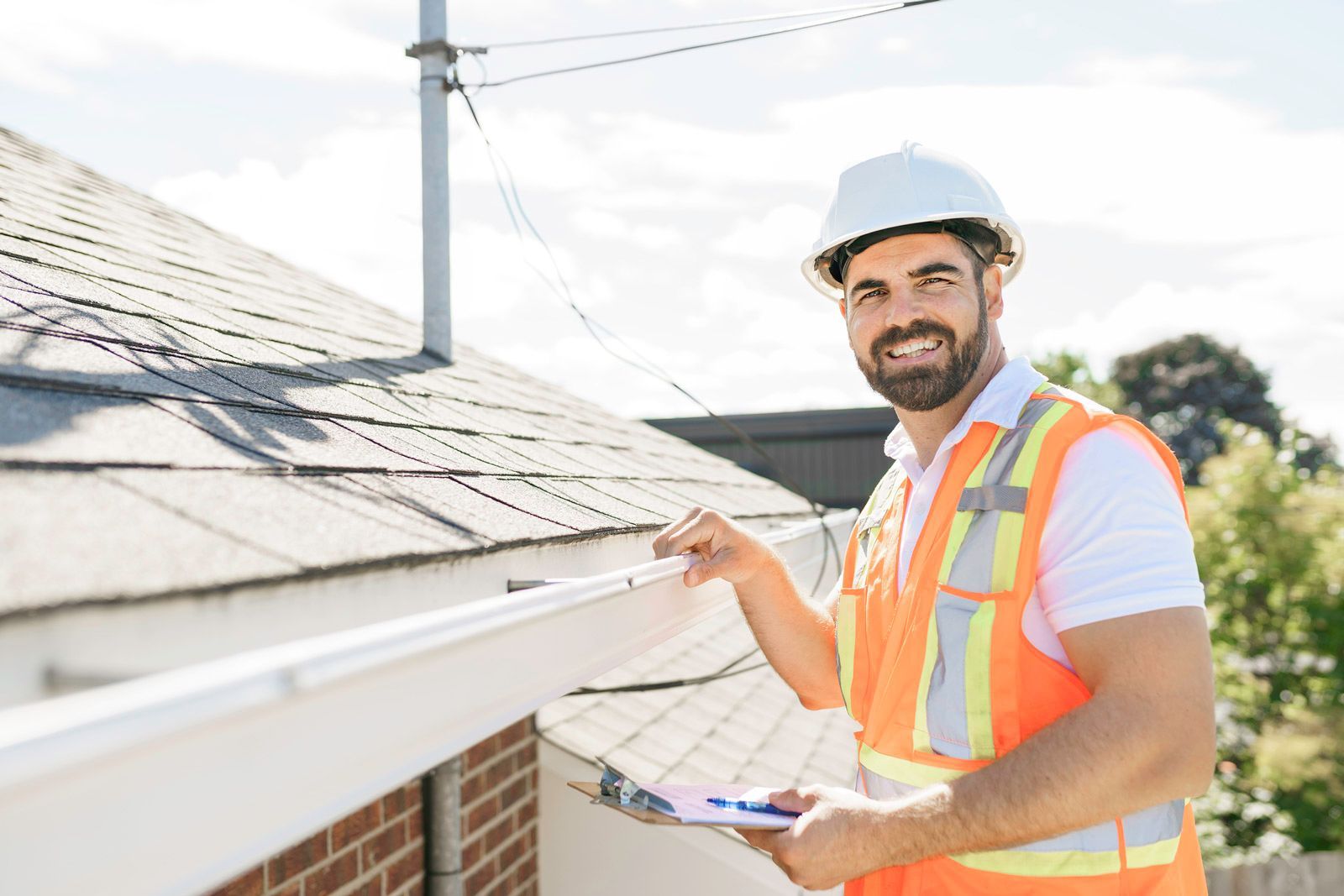 Man Checking The Roof — Madison, WI — TOTL Construction, LLC Man Checking The Roof — Madison, WI — TOTL Construction, LLC