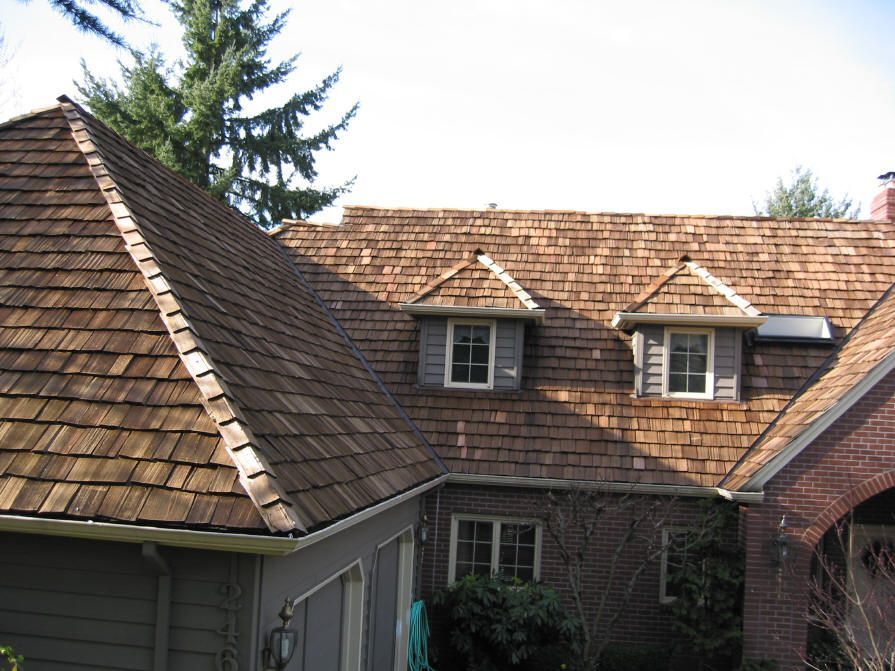 A house with a wooden roof and two windows