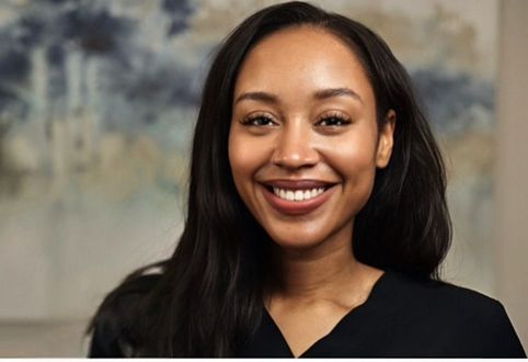 Portrait of a Zsane Alexander, Office Manager for Dr. Donald Marks, against a soft indoor background.
