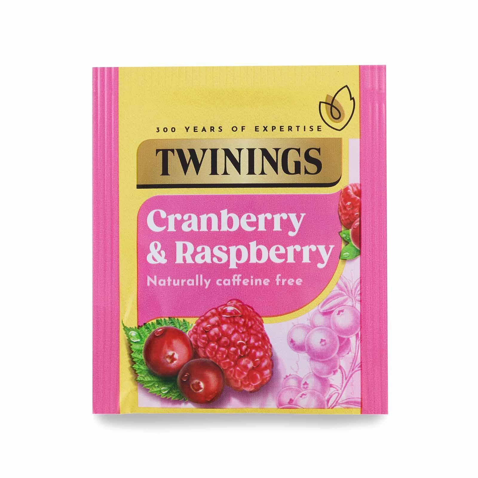 Twinings Cranberry & Raspberry herbal tea packet with pink packaging and fruit illustration