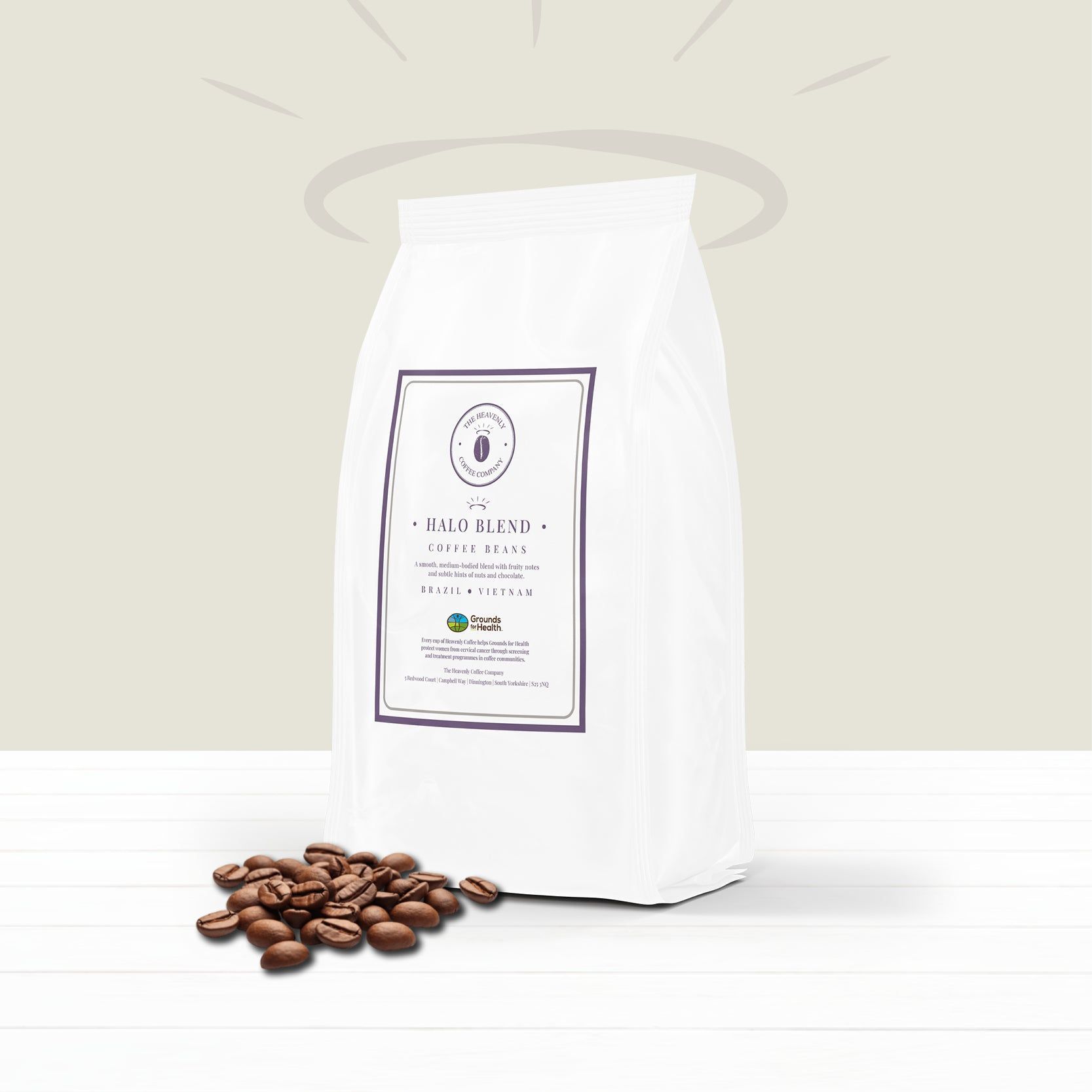 White coffee bag with beans on a light background, labeled with a minimalist logo.