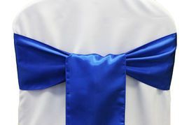 Blue satin bow tied around the back of a white chair