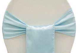 Light blue satin bow tie draped across a white mannequin torso