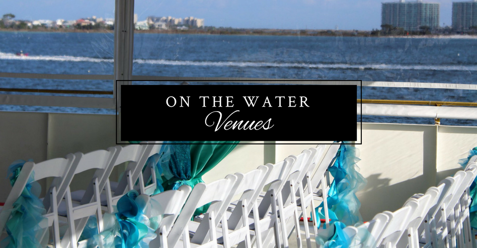 Waterfront event setup with white chairs and turquoise decorations, sign reading “On the Water Venues”