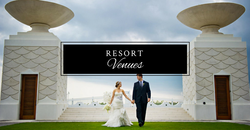 Bride and groom walking in front of a Resort Venuel sign