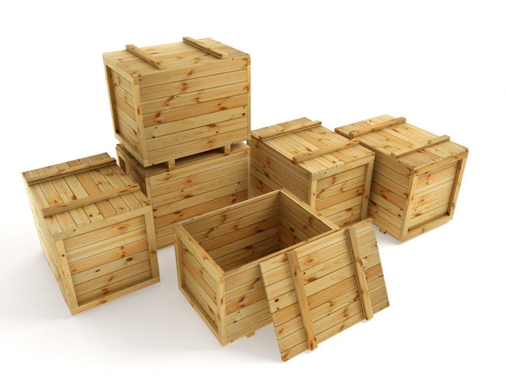 Several open wooden crates stacked and scattered on a white background