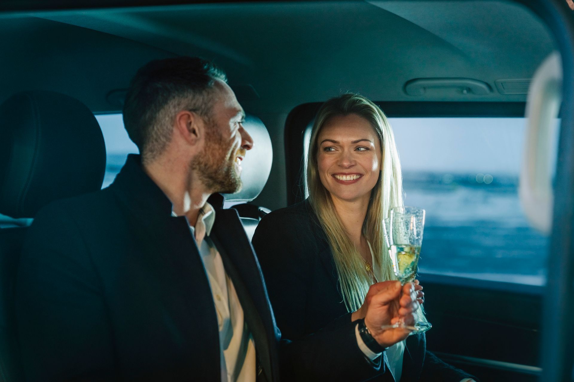 couple enjoying luxury car service