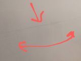 two red arrows pointing in opposite directions on a white surface .
