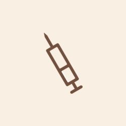 an icon of a syringe with a needle on a beige background .