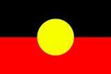 a red , black and yellow flag with a yellow circle in the middle .
