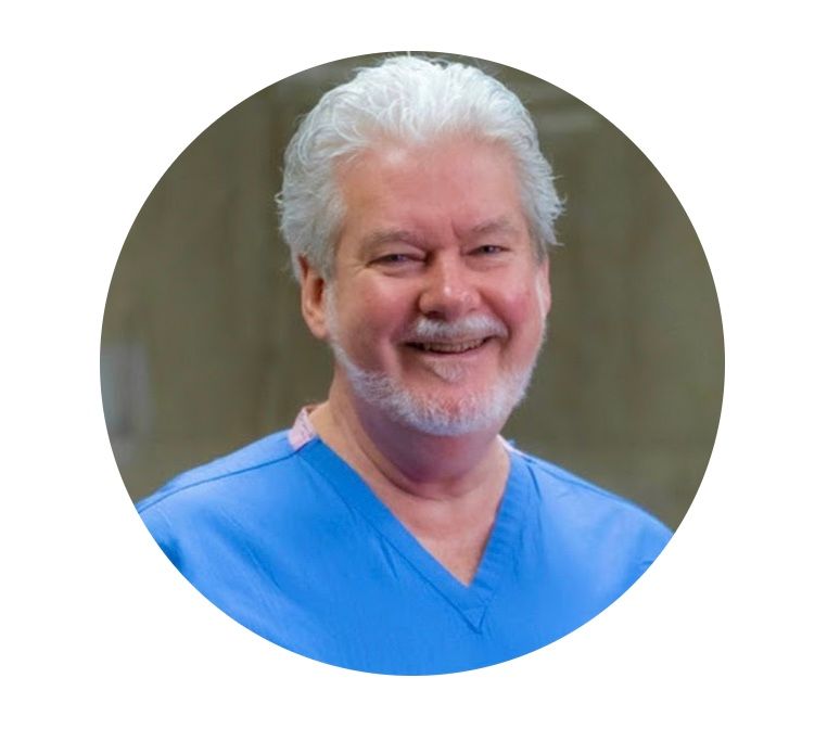 A man with a beard wearing a blue scrub top A man with a beard wearing a blue scrub top