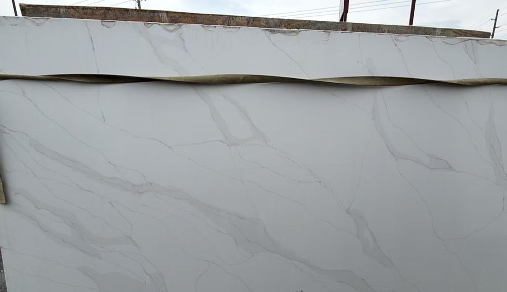 White wall with a long horizontal crack near the top edge