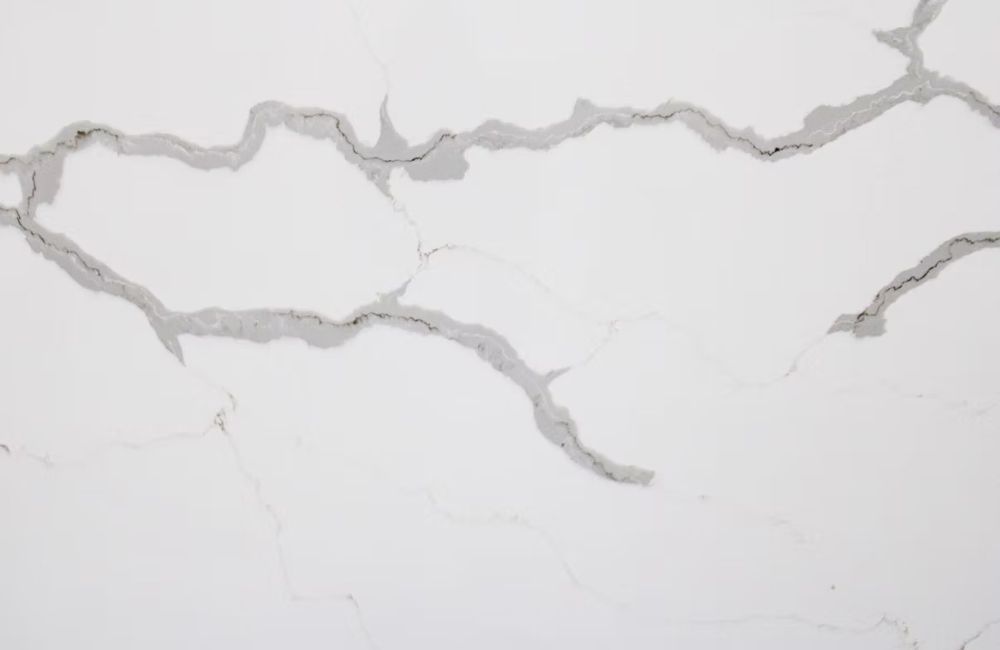 White marble surface with gray veining and cracks