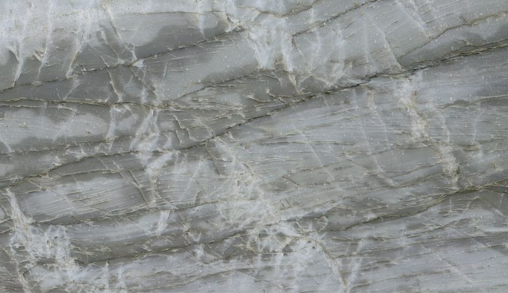 Gray veined marble stone surface with subtle white streaks and layered texture