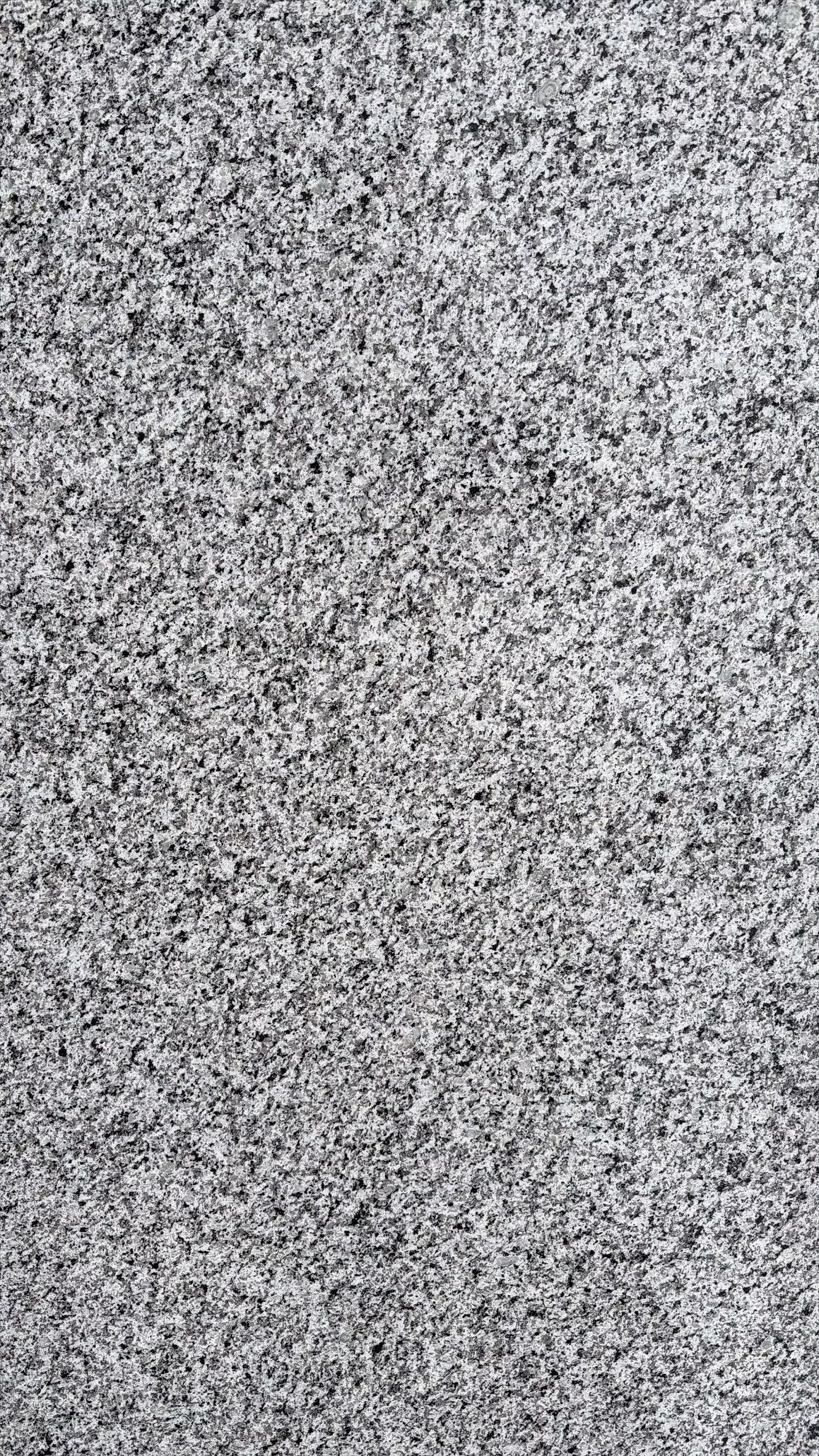 Dark gray and white marble or stone surface with veined texture