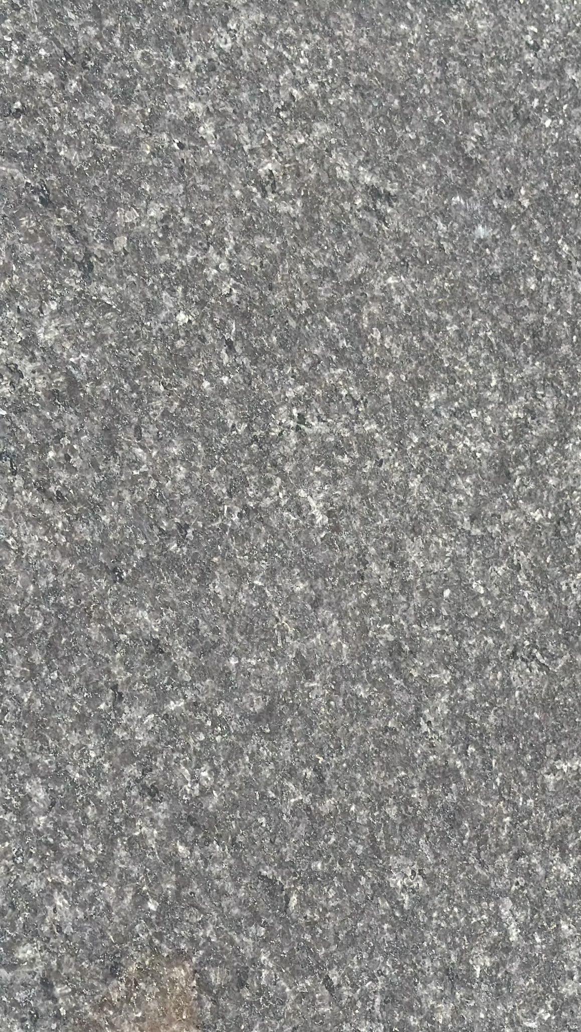 Close-up of a speckled gray textured surface.