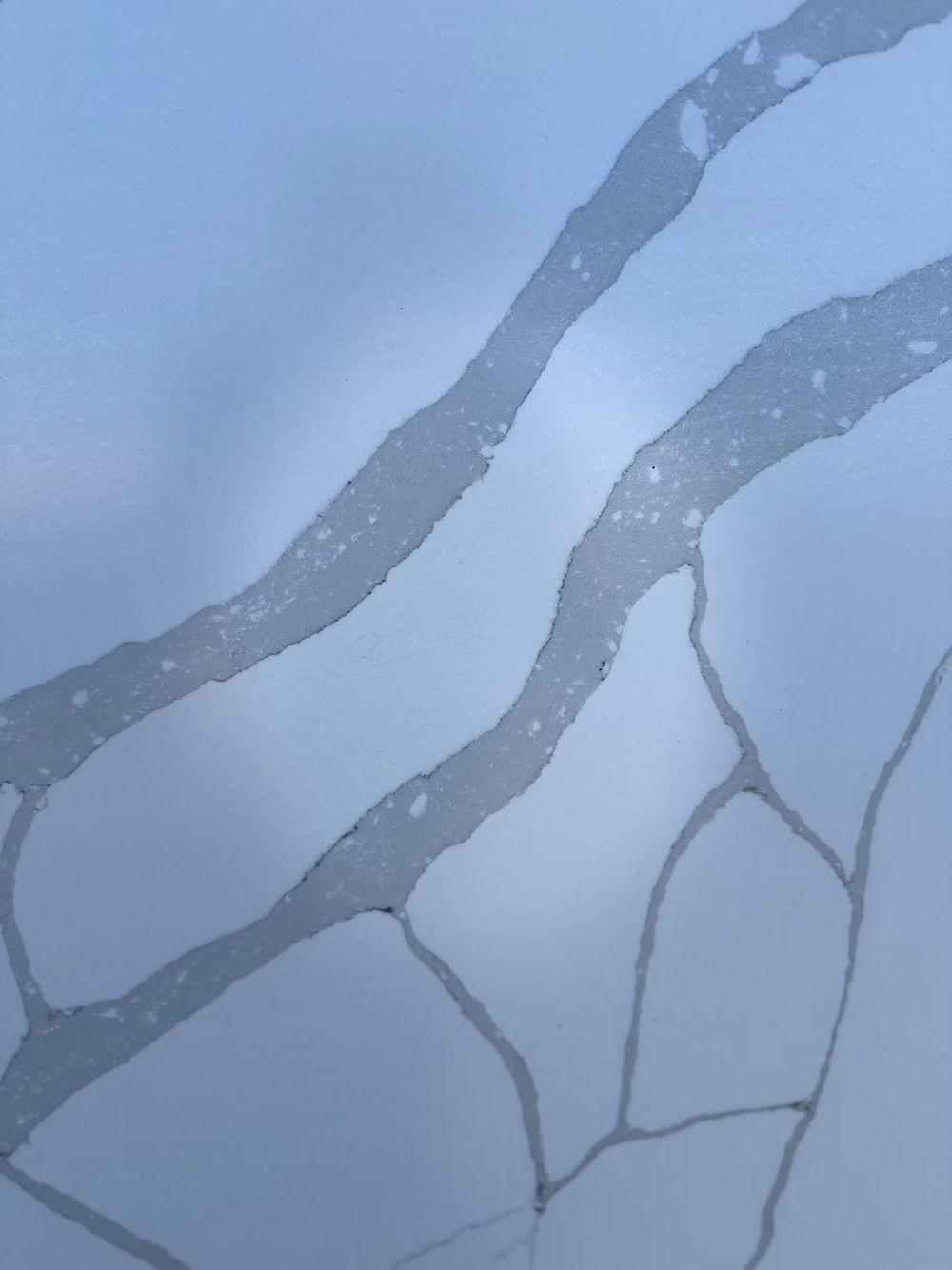 Light gray marble surface with dark veining patterns