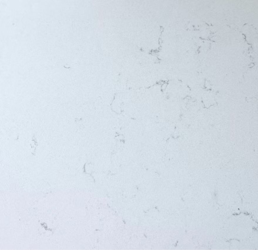 Light gray textured wall with subtle scuffs and faint marks