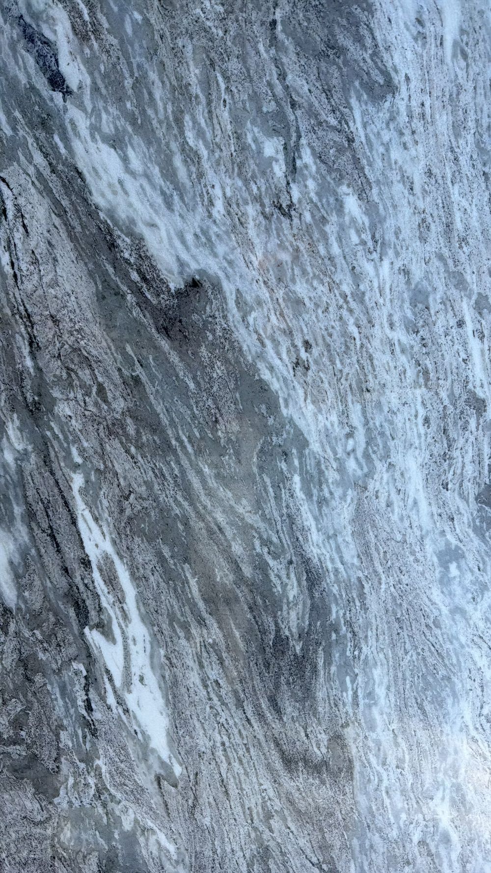 Blue-gray stone surface with veined, textured pattern