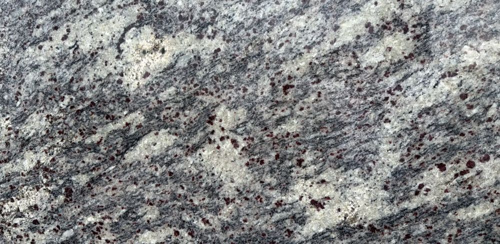 Gray and white speckled granite surface with dark veining