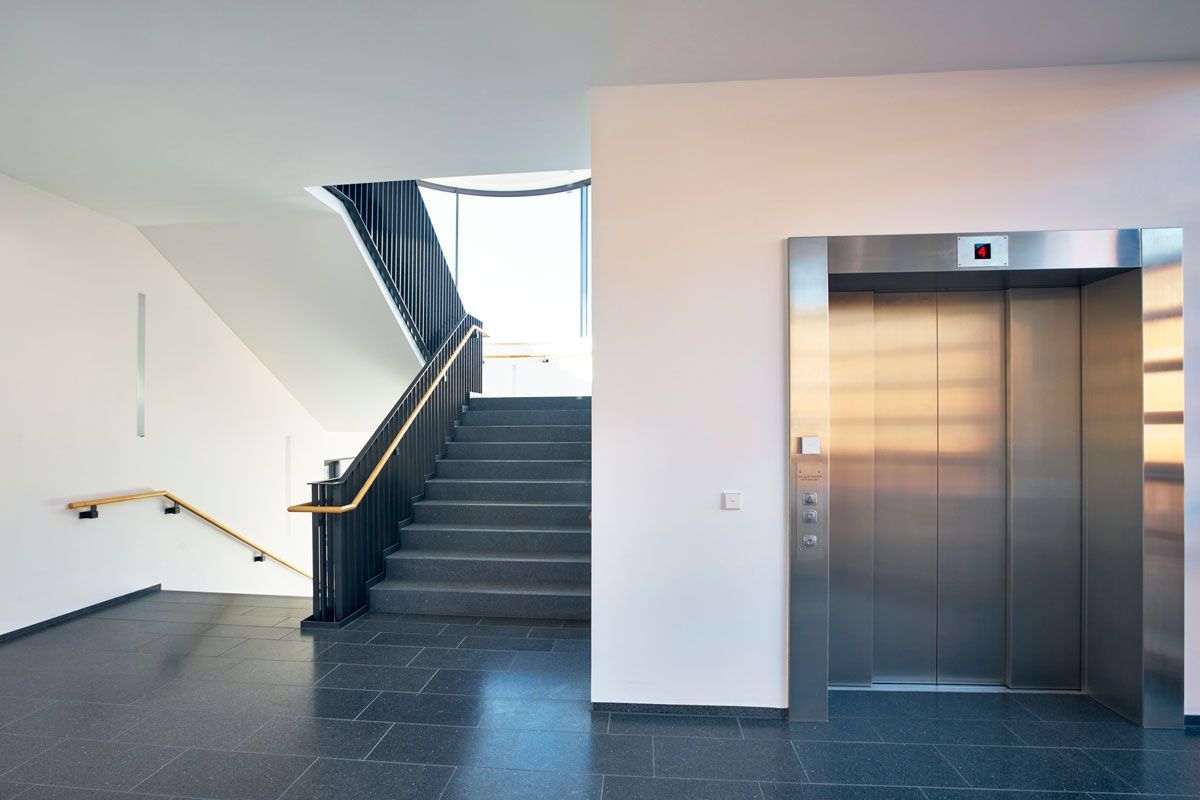 A staircase and an elevator in a building