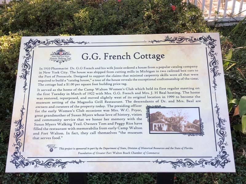 Plaque titled “G.G. French Cottage” with decorative border and a small inset photo of the house.