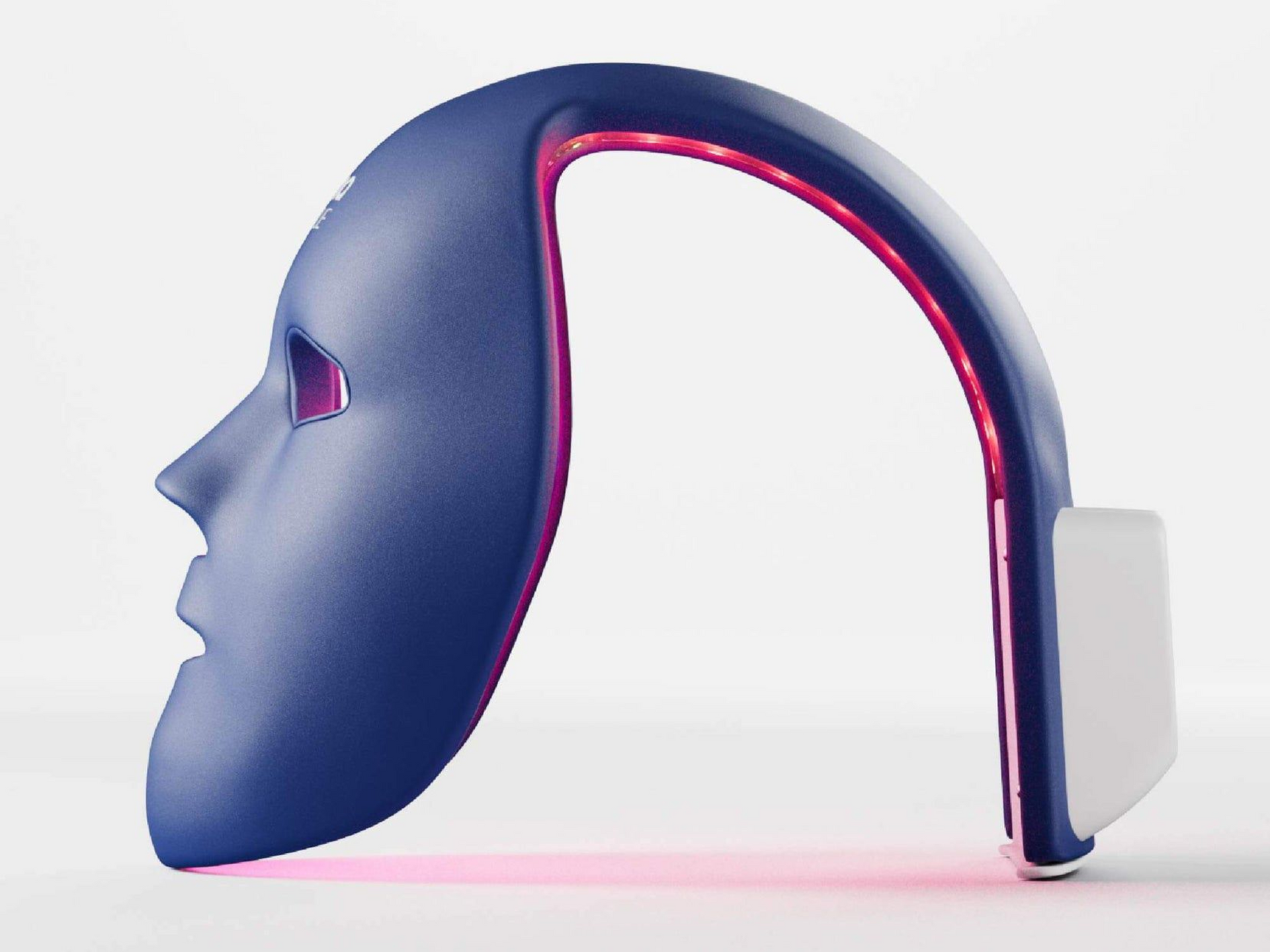 Woman lit by pink light beside a curved neon LED ring