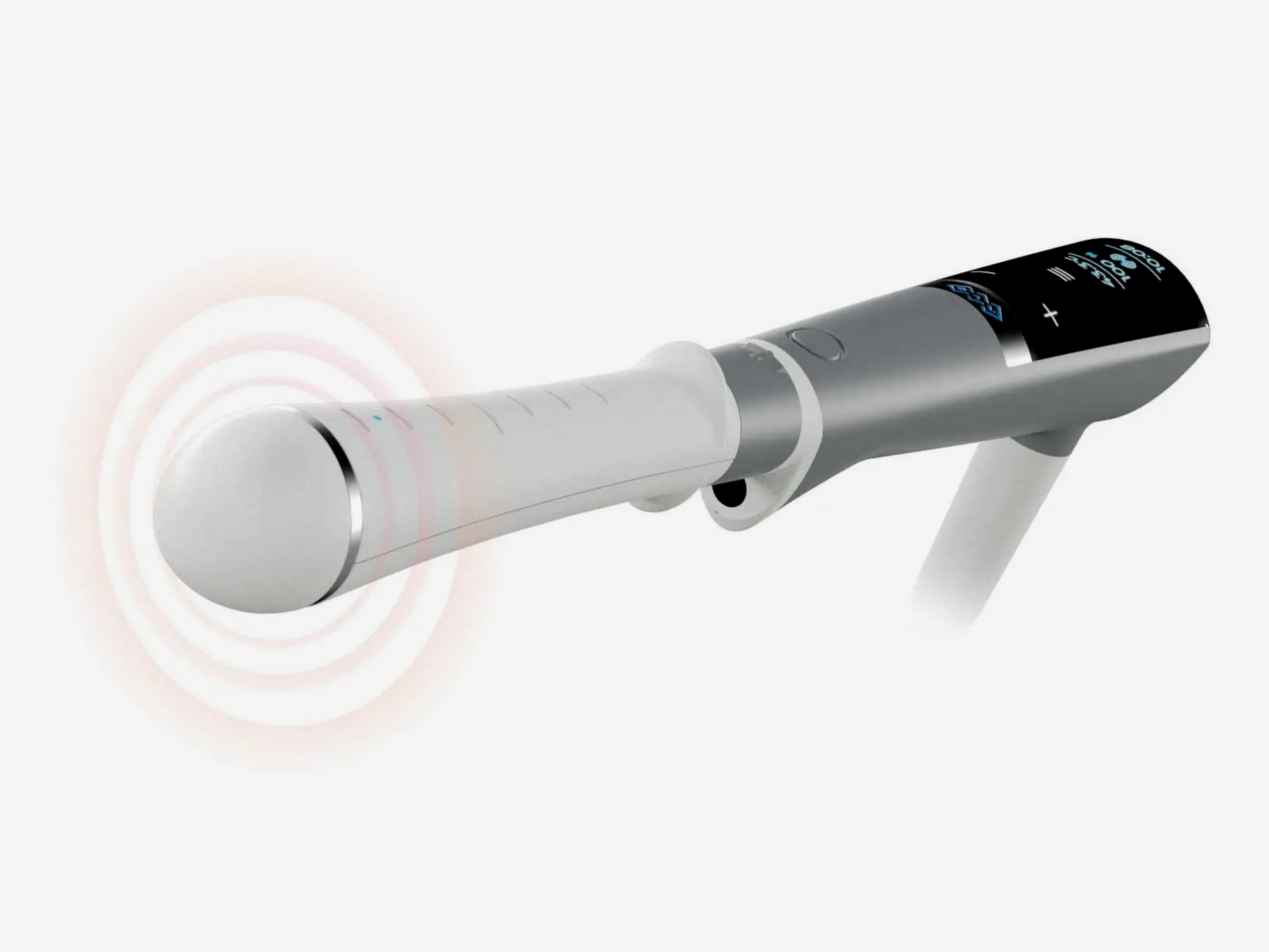 Handheld white and black EMFEMME device with a round attachment emitting vibration waves