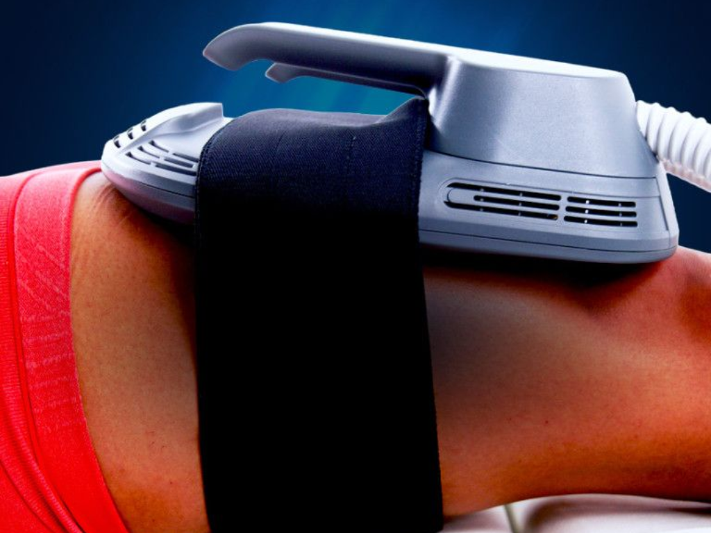 Wearable fitness tracker strapped to a forearm with a black band and white device