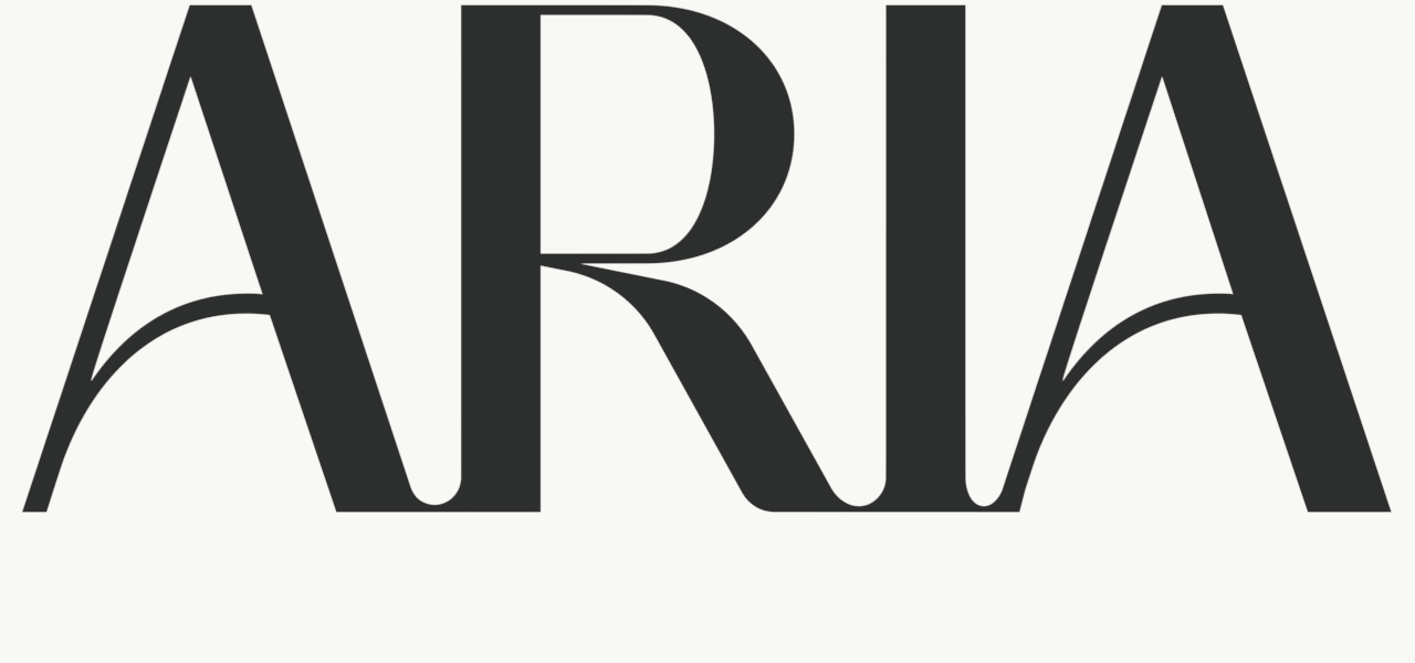 ARIA DENTAL STUDIO logo in elegant black serif lettering on a light background