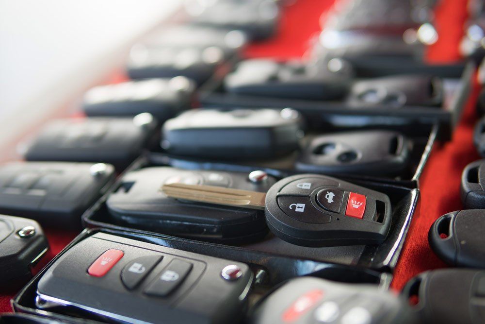 Locksmith Stand with Variety of Car Keys — Lake Macquarie Mobile Locksmiths in Caves Beach, NSW