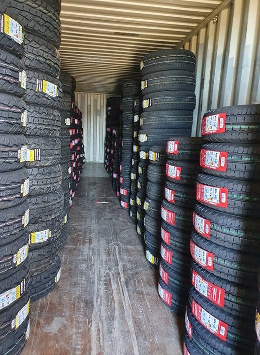 A Pile Of Tires Stacked On Top Of Each Other In A Garage — Johnny Farming Company In Ooralea, QLD