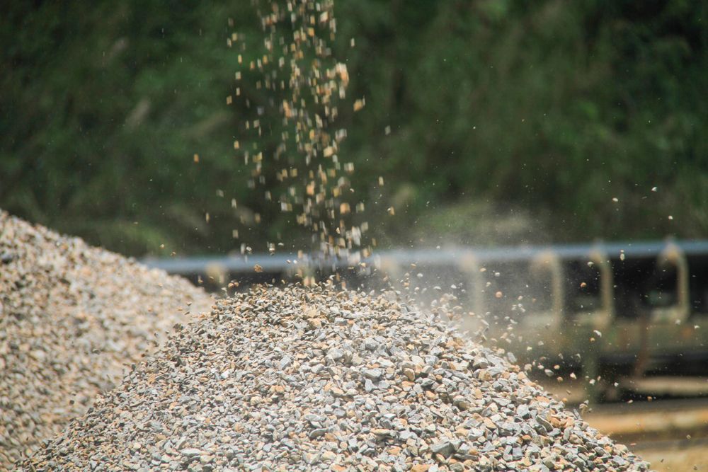 A Pile Of Crushed Concrete Is Being Poured Onto A Conveyor Belt — Johnny Farming Company In Ooralea, QLD