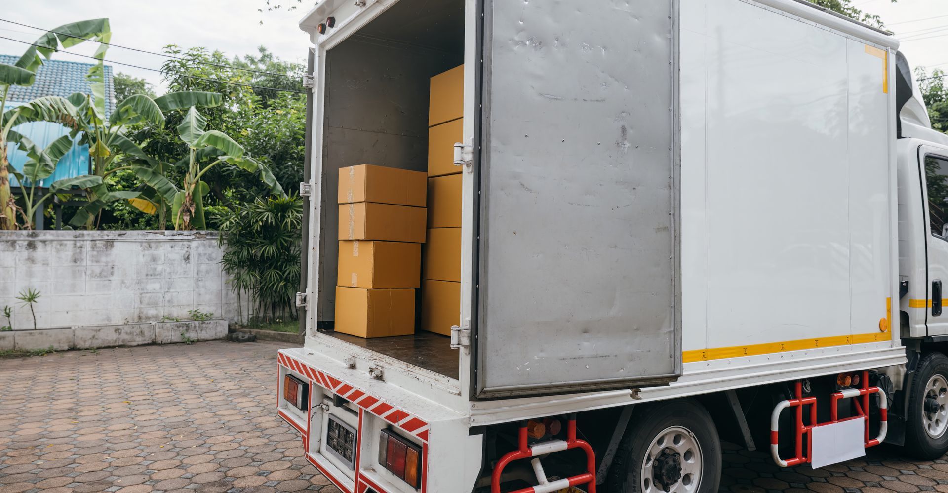 White Delivery Truck With Open Back Door, Stacked Boxes Inside — Johnny Farming Company In Ooralea, QLD
