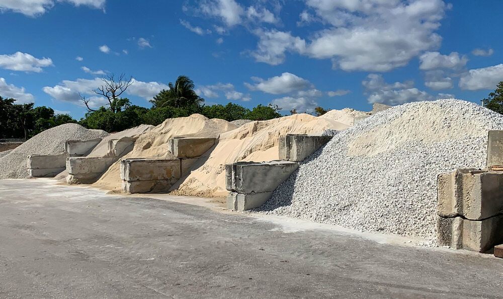 A Pile Of Gravel Is Sitting On Top Of A Concrete Block — Johnny Farming Company In Ooralea, QLD