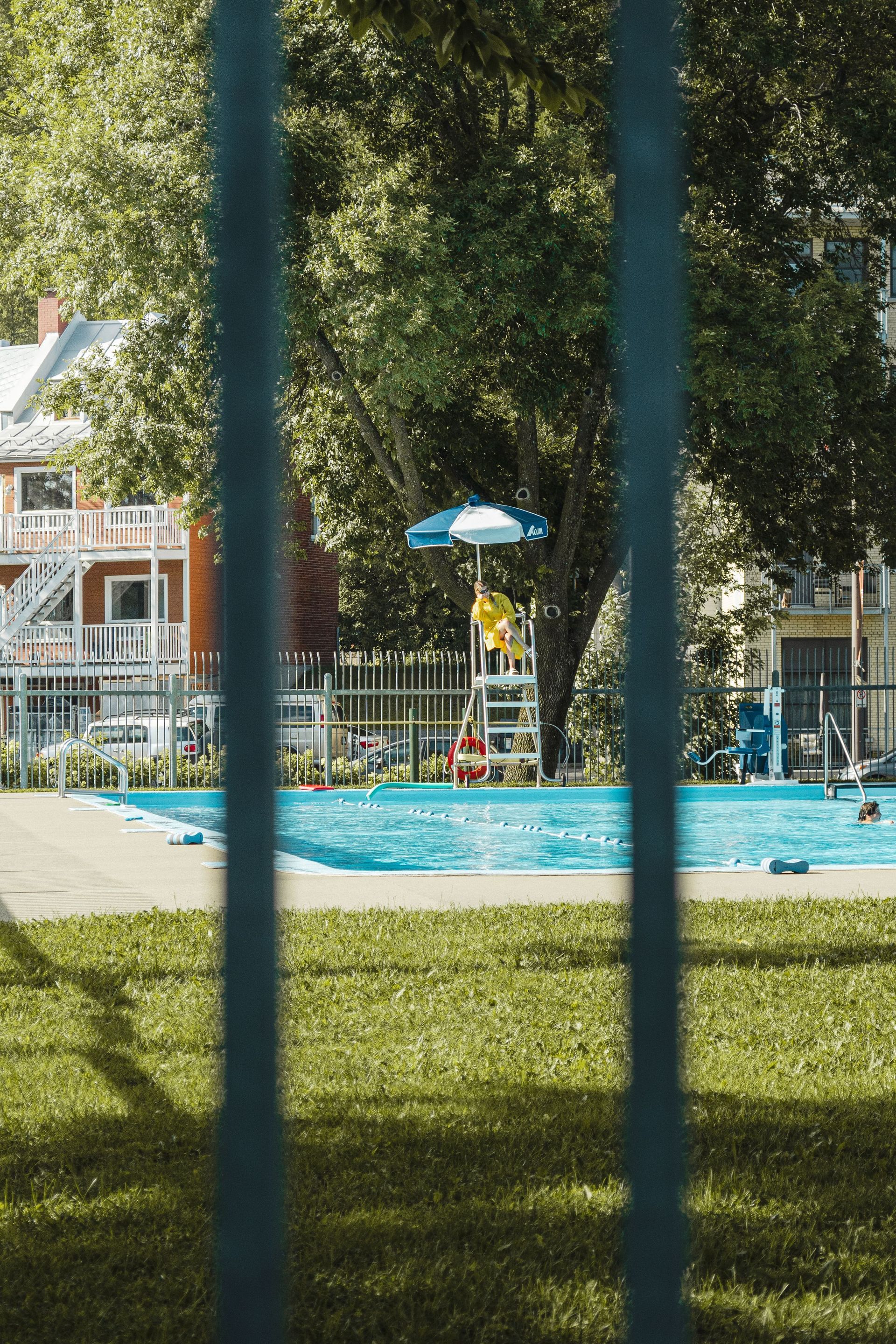 a pool on the other side of a fence