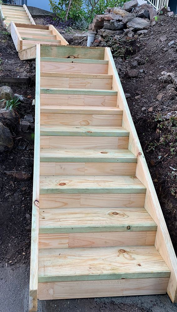 A Set of Wooden Stairs Going up A Hill — Tradewind Building Maintenance in Bulli,NSW