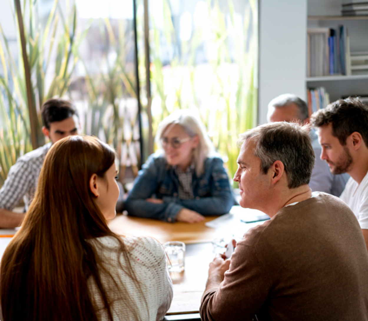 Family sitting around dining room table to discuss estate planning