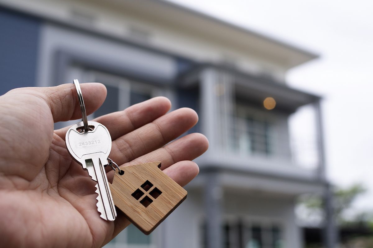 Keys being handed over after the sale of a home
