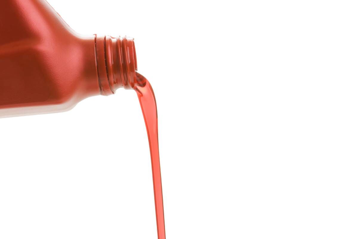 Transmission fluid pouring out of a bottle near Cincinnati, OH