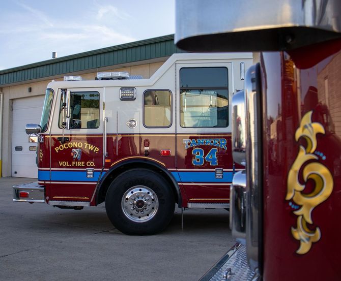 A red and white fire truck with the number 34 on it