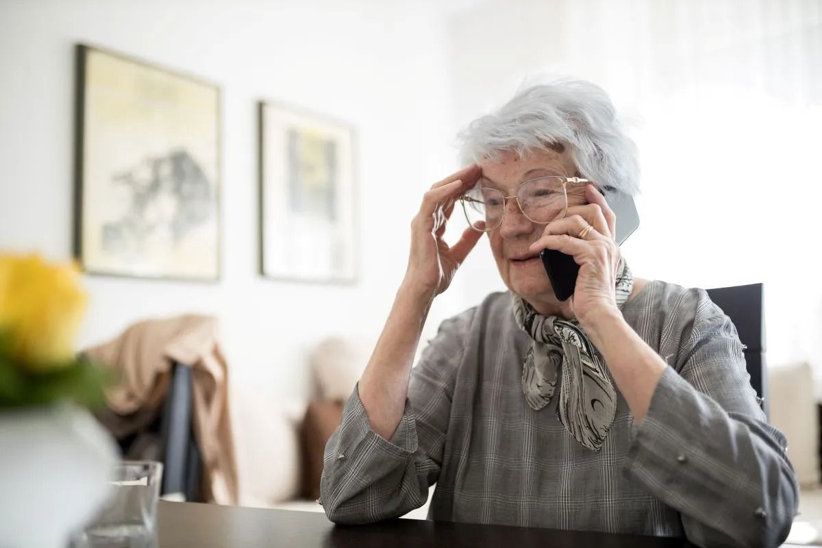 person sitting on a couch looking out the window