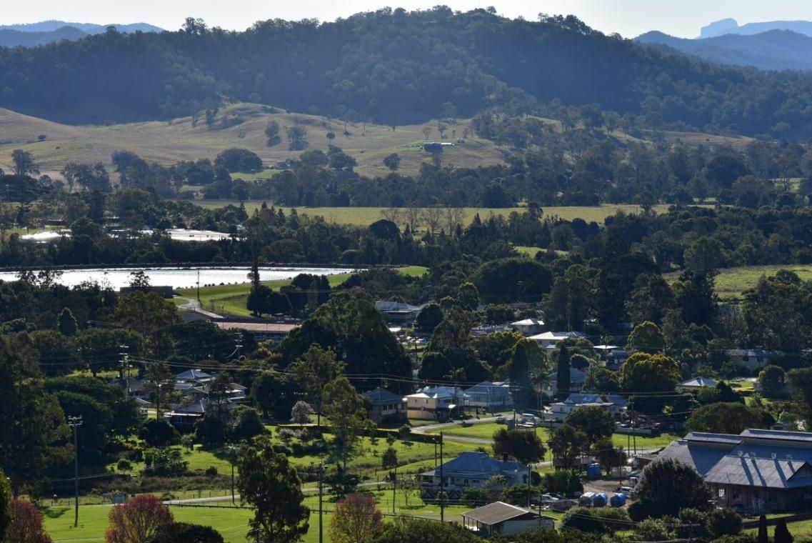 An Aerial View of A Small Town with Mountains in The Background — Natraspray Lismore in Kyogle, NSW