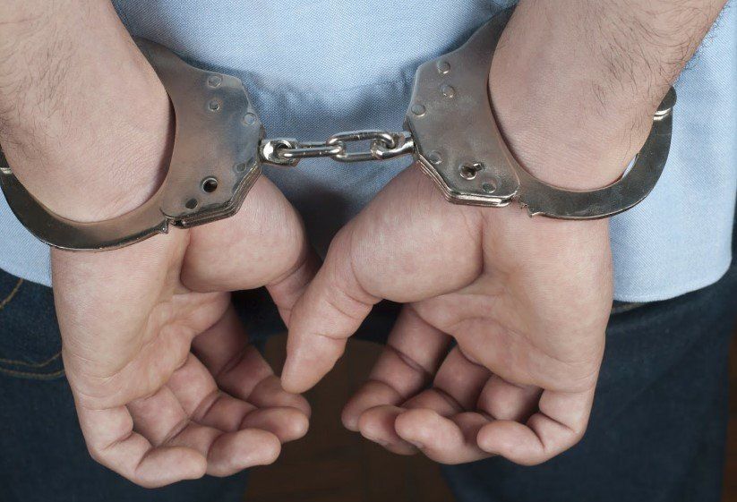 Man In Handcuff — Santa Ana, CA — Don's Bail Bonds Man In Handcuff — Santa Ana, CA — Don's Bail Bonds