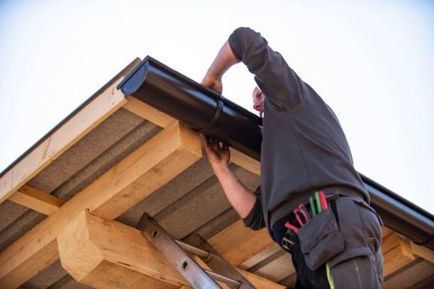 Correctly fastened downspout on residential siding, as fitted during gutter installation Morristown