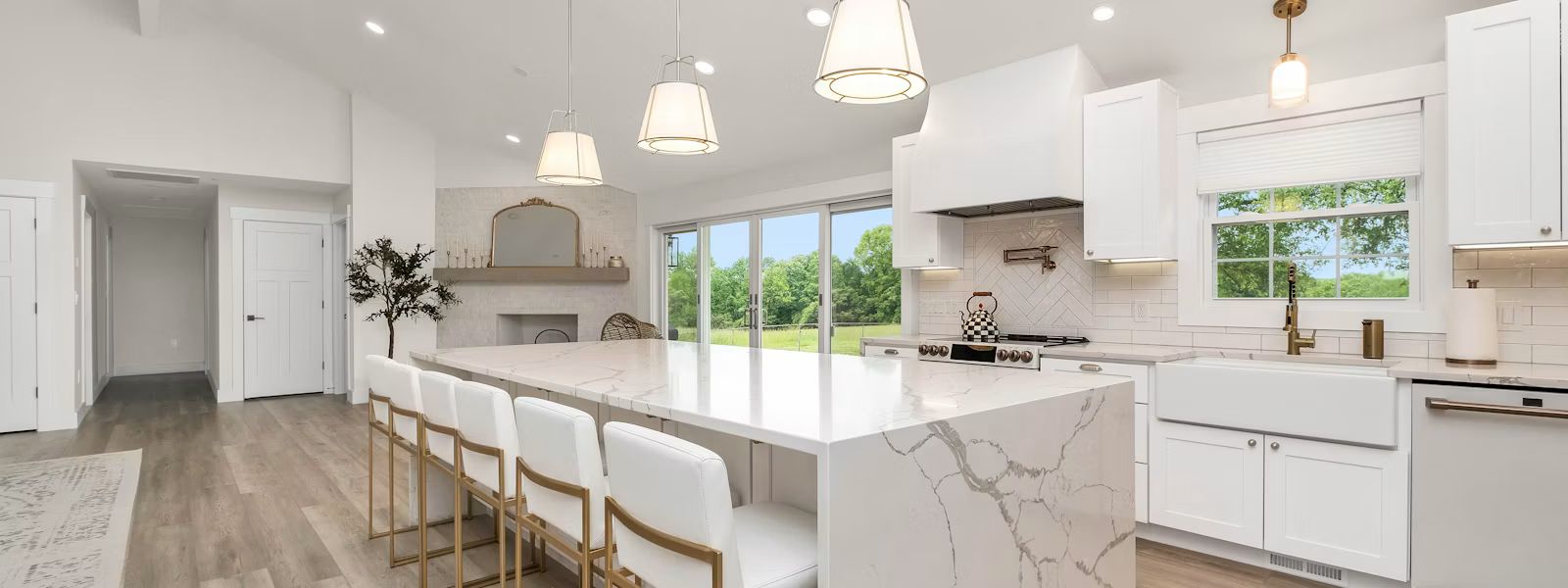 Modern white kitchen remodel with marble island and custom cabinets in Sevierville TN by Heavy Dutys Construction